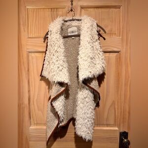 Faux leather/shearling vest.